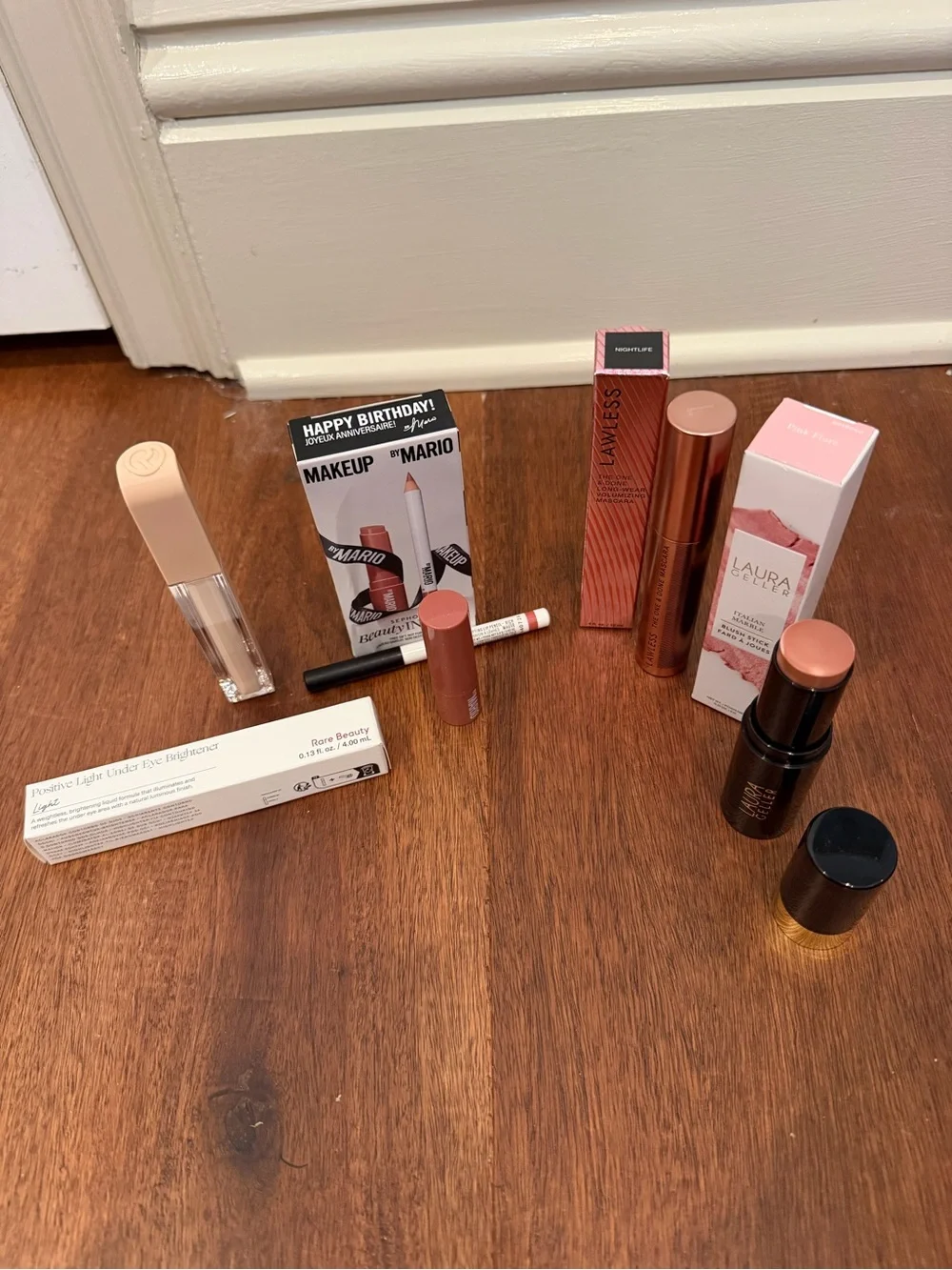 Laura Geller Peach Pink blush, lawless mascara, Mario set, rare beauty concealer